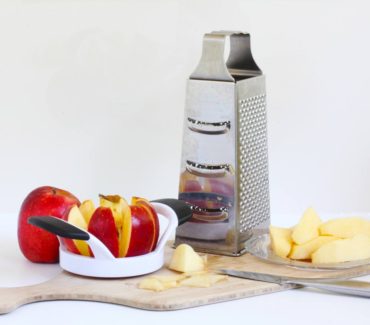 Apples made ready for infusion by coring, peeling and shredding them.