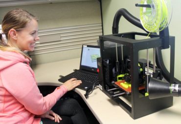 Liz Athey using a 3-D printer at the Gig Harbor Library