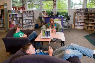 Teens with electronics at the Gig Harbor Library are a common sight.