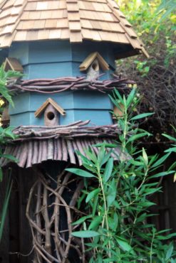 A blue house is both beautiful and functional for birds that like living in condo-like conditions.
