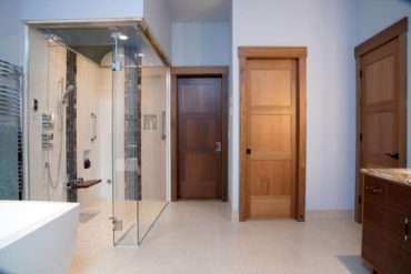 Five carefully selected tiles comprise this steam shower with a vaulted ceiling.