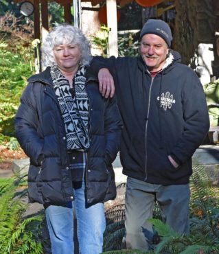 Dave and Lori Gibson in their woodland garden