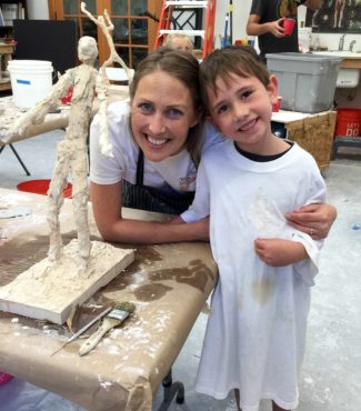 Rees with Andrew Garcia after he completed art camp, where he created his very own “Alberto Giacometti” inspired sculpture in plaster.