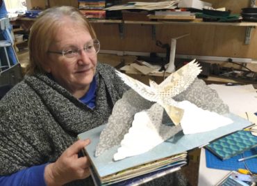 Book Arts Studio lead M.J. Christensen demonstrates 3D book making.