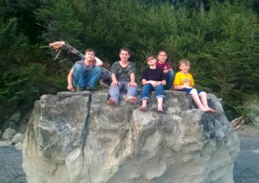 Boy Scouts Troop 220 relax on top of a rock at Third Beach (La Push) in Olympic National Park after hiking to the beach and setting up camp. Left to right are Cian Quill, Josh Helland, Aiden Myers-Sackett, Austin Mayger and Brandon DeWitt.