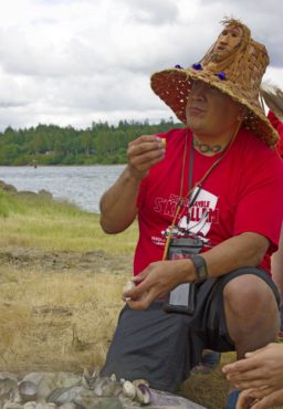 A Port Gamble S'Klallam Tribe member enjoys a clam bake at Port Gamble Bay in June 2017. (Photo courtesy Tiffany Royal/Northwest Indian Fisheries Commission)