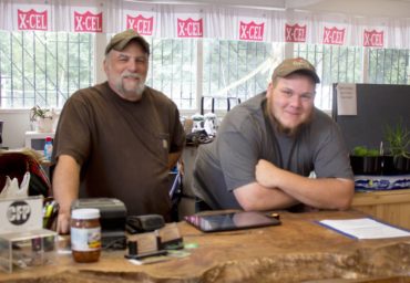 Rick Mielke, owner of Redneck Feeds, with helper