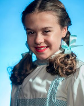 Emily Fox as Dorothy with Caesar Weaver as Toto (Photo courtesy Derek Villanueva)