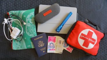 A few of the travel essentials: passport, tablet, a bag of chargers and adaptors, packets of Woolite, small flashlight, extra glasses, first aid kit and a sink stopper. Use the sink stopper and Woolite when you need to wash clothes in a sink.