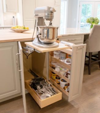 Base cabinet mixer lift with rollout accessory drawer and pullout pantry (Photo courtesy A Kitchen That Works LLC)