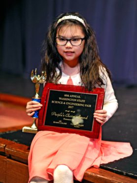 Proud student — People's Choice Award and first-place trophy