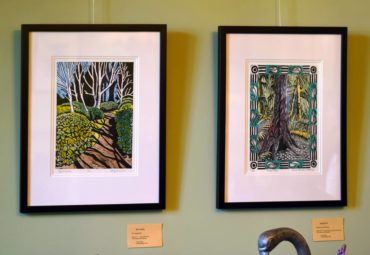 "Birch Garde"" by Erica Applewhite and "Bloedel Stroll" by Denise Cormier Mahoney are two of a dozen prints on display through June in the dining room in the residence at Bloedel Reserve.