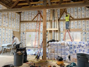 Insulating work on The Little White Barn, a Company + Cottage project