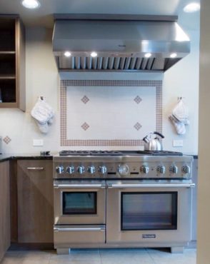 Freestanding professional range with convection oven, steam oven, warming drawer, six burners and griddle (Photo courtesy A Kitchen That Works, LLC)