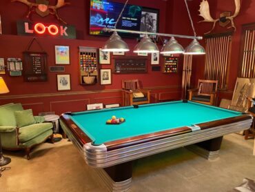 Smalley's garage features a 1945 Brunswick 9-foot billiards table, a sign from the '20s from the Crow's Nest Tavern; a 1940s jukebox from the Pearl Maurer dance hall and Leonard, the movie theater ticket-taker from Bremerton's Roxy Theatre.