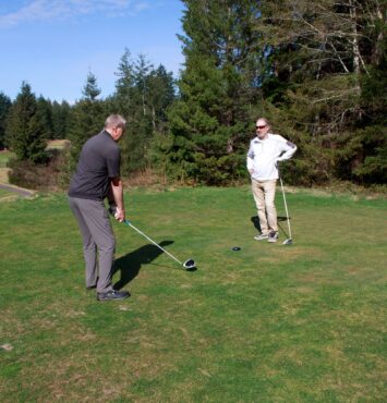 Golfers Steve Decoy and Frank Horton playing at Gold Mountain