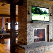 In this beautiful game room, a golf simulator/home theater system was installed along with multiple custom Focal in-ceiling speakers and JL Audio subwoofers. This entertainment can easily be controlled with keypads or one-touch, universal, hand-held remote controls.