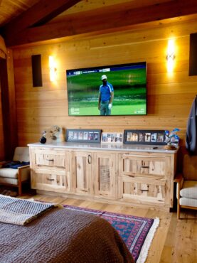 The master bedroom is equipped with a surround-sound system including Focal in-wall and ceiling speakers and a concealed, cabinet-mounted subwoofer.