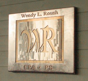 Stainless-steel sign by Jackson at CPA Wendy L. Roush's office