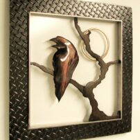 Raven Moon, made from oxidized steel and bronze, is about 3 feet square.