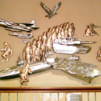 This bronze and stainless-steel wall sculpture, titled "Homage to Heroes," was commissioned for the Patriots Landing retirement center for armed forces officers in DuPont, Washington.