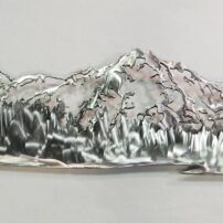 Clients from Henderson Bay area commissioned this 5-foot-wide, stainless-steel, wall sculpture to depict the south view of the Olympic Mountains from their home.
