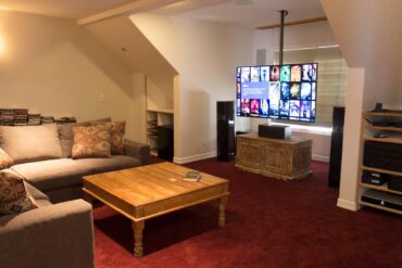 Upstairs media room equipped with a 9-speaker surround system, along with a library of totally uncompressed movies and concerts