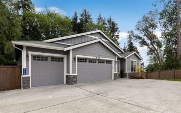 These garage doors feature raised panels and windows along the top. (Photo courtesy Eileen Black)