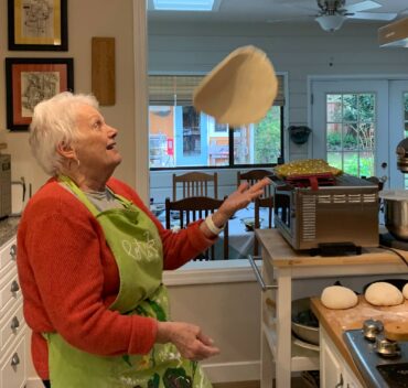 Barb Bourscheidt playing with a pizza crust