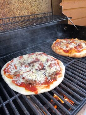 Pizza on a hot grill