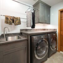 Laundry sink, drying racks, storage and folding area (Photo courtesy A Kitchen That Works LLC)