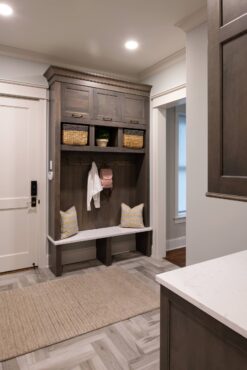 This boot bench provides an aesthic transition into the kitchen. (Photo courtesy Dura Supreme Cabinetry)
