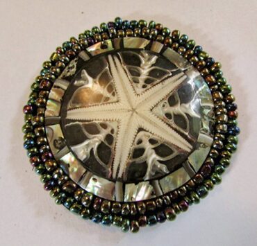 Mariam Barnett’s jewelry, like this brooch, will be on display.