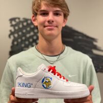Chandler King with his custom-designed shoes by his big brother, Connor