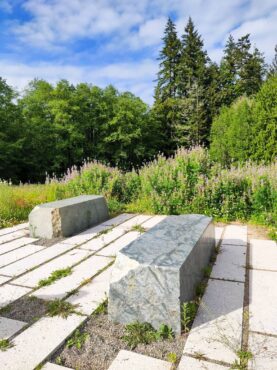 The stone benches at the top of the pollinator meadow hill