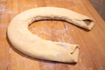 Fold remaining dough over the first and pinch to seal.