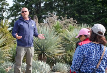 Horticulturist Bryon Jones gives a private botanical garden tour to a garden communicators group.