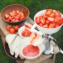 Tomato press and sauce makers turn garden-ripe tomatoes into seed-free, skin-free sauce with the turn of a handle. (Photo courtesy Gardener's Supply Company)