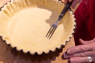 Dock (prick) crust for even baking.