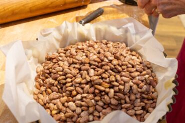 Line dough with parchment and fill with beans.