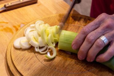 Fresh alliums complement the mushrooms.