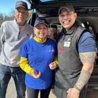 Carol Virak and Dick Siler with Kyle, the manager of WinCo