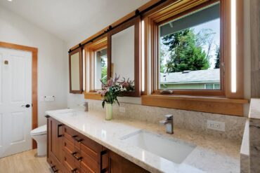 This custom home had been designed for a bachelor. McCabe remodeled the bath to provide accommodations for two. (Photo courtesy Tammy Dwight Photography)