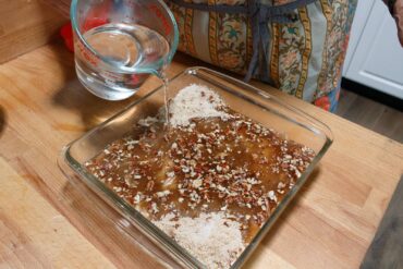 Sprinkle topping over batter and add water without stirring.