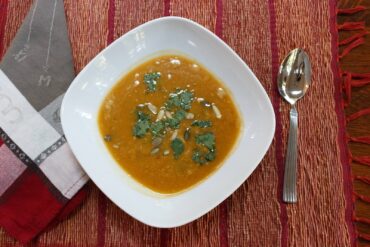 Barb’s Thai-style pumpkin soup garnished with fresh cilantro and pumpkin seeds.
