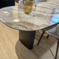Porcelain slabs are not just for countertops. Grespania Ceramica is partnering with high-end furniture makers to create table tops and more.