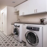 Cemenititious floor tiles — laundry room design by McCabe By Design