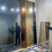 Mirror Collection by Apavisa is a slab format porcelain tile made with a physical vapor deposition process, creating a tintable and highly reflective, mirror-like surface.