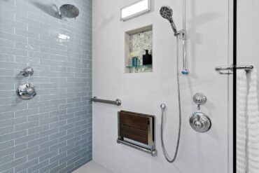 Thermostatic and volume control shower valves, fold-up shower seat, grab bar and hand-held shower on a slide bar all facilitate aging in place — design by McCabe By Design. (Photo Courtesy Tammy Dwight)