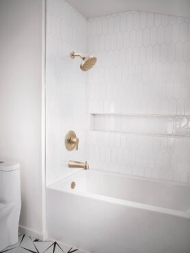 Moen Rinza fixed shower head, pressure-balance valve and tub spout in brushed gold